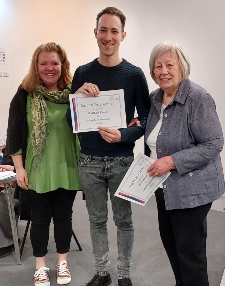 Matthew Keeley is presented with a certificate for 2nd place in the Greg Gillen Competition, for a science fiction story. He is shown with adjudicator, Sam Oakley and Competition secretary, Adriene Whitehall.